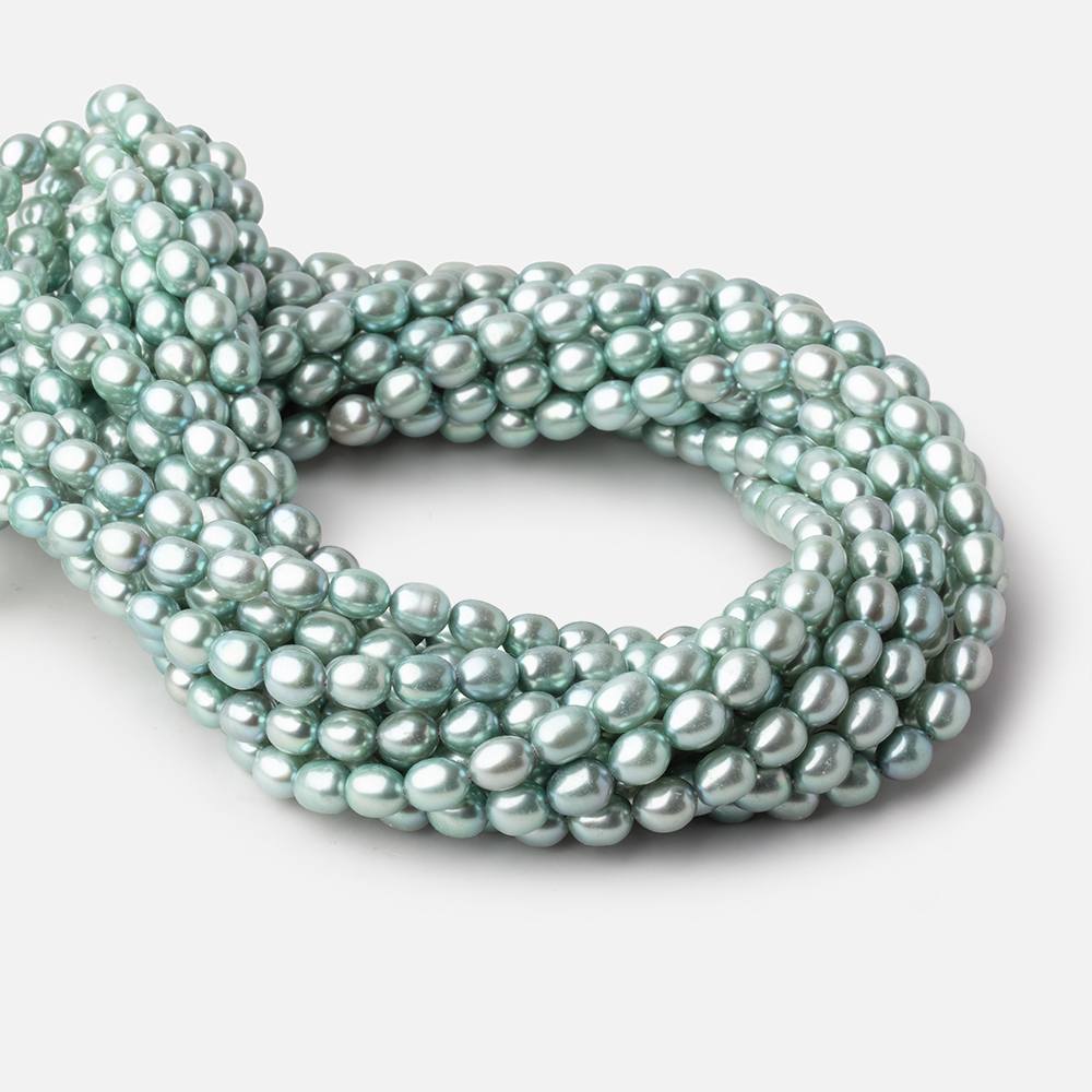 7 - 8mm Mint Green Oval Pearls 16 inch 55 beads - The Bead Traders